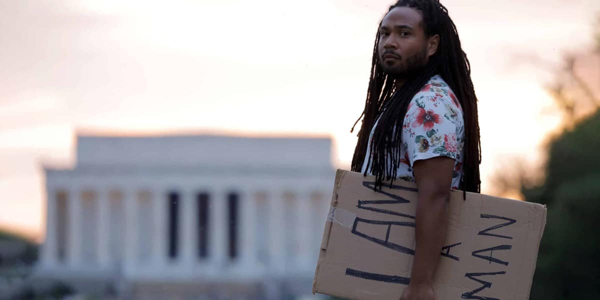 Man holding a sign in Washington DC