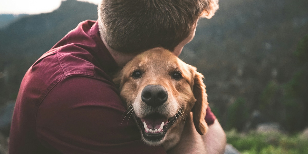 man holding his dog