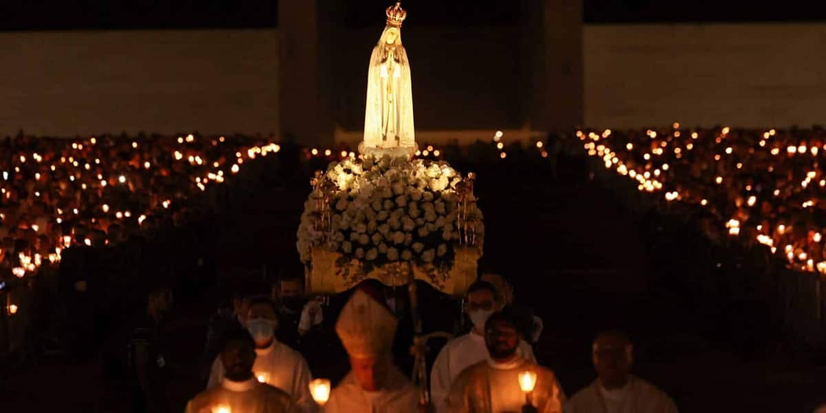 Statue of Our Lady of Fatima surrounded by candles