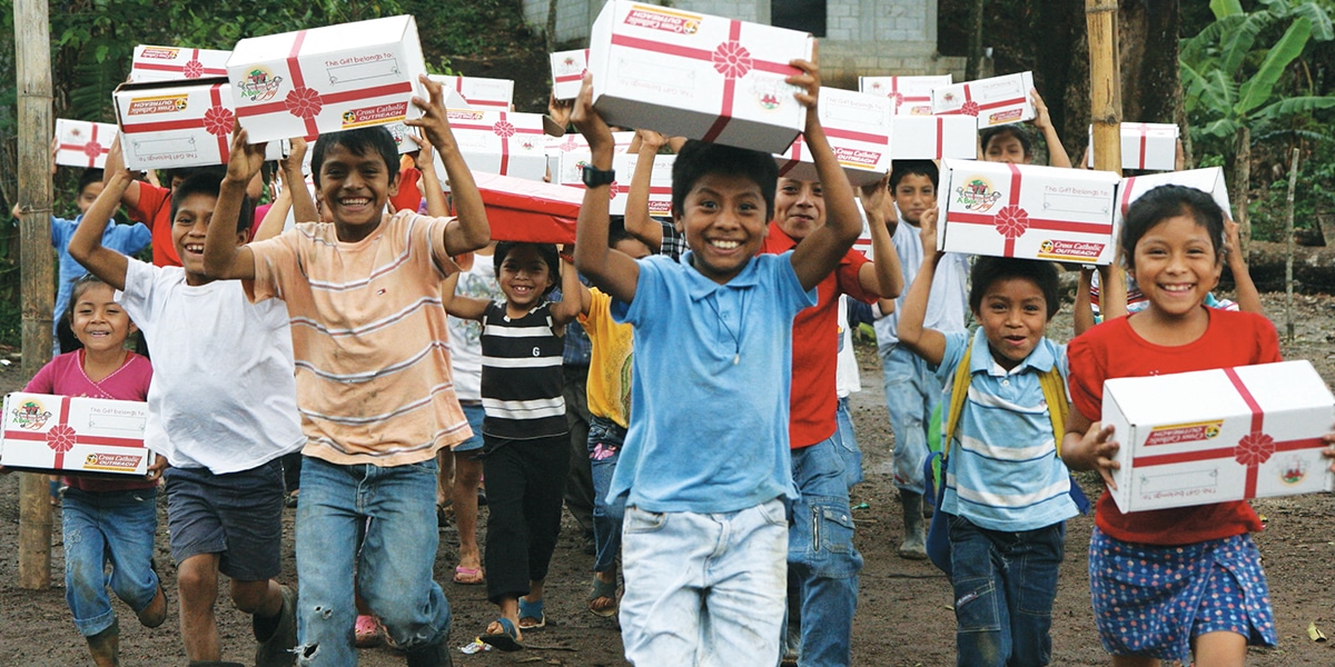 Kids happy having received a Box of Joy