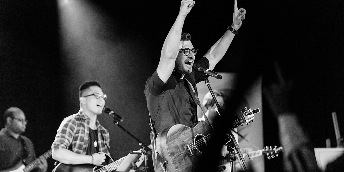 Father Rob Galea performing a concert