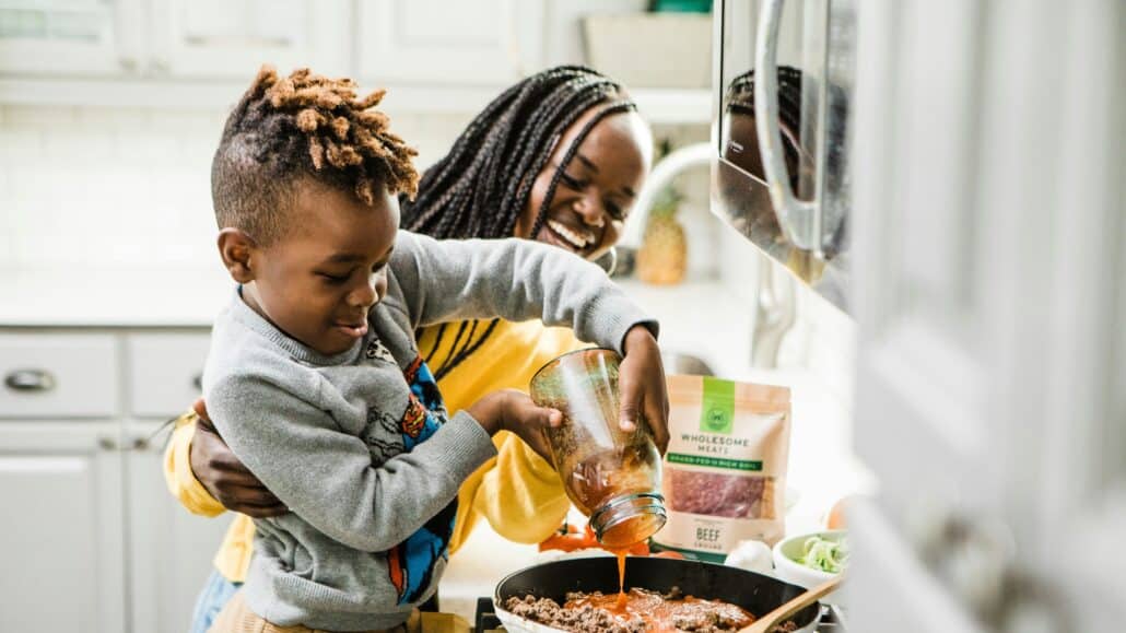 Mother and son cooking | Photo by Brooke Lark on Unsplash