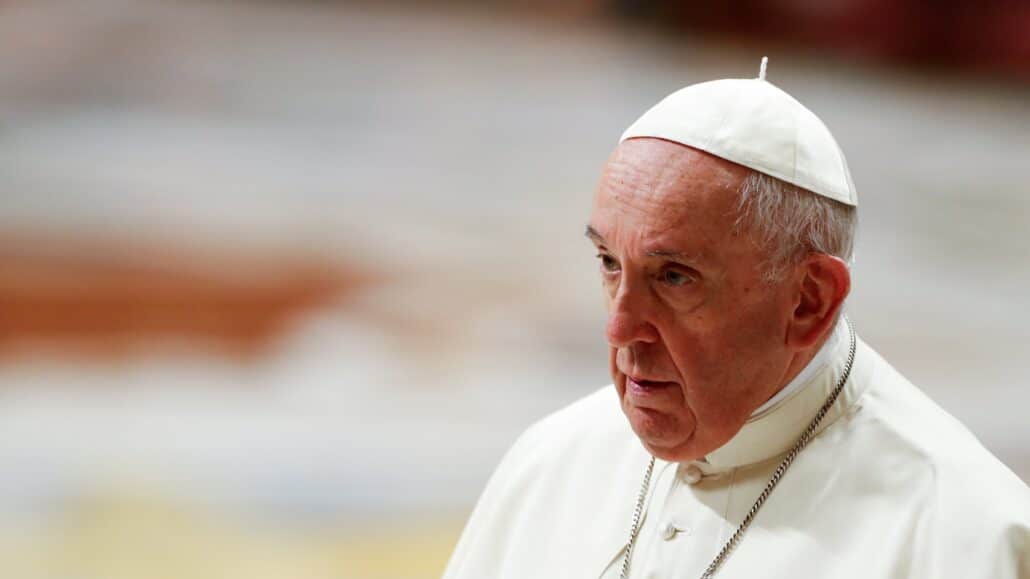 Pope Francis leaves at the conclusion of an evening prayer service in St. Peter's Basilica at the Vatican Dec. 31, 2021. The traditional service on New Year's Eve is to give thanks for the past year. (CNS photo/Remo Casilli, Reuters)