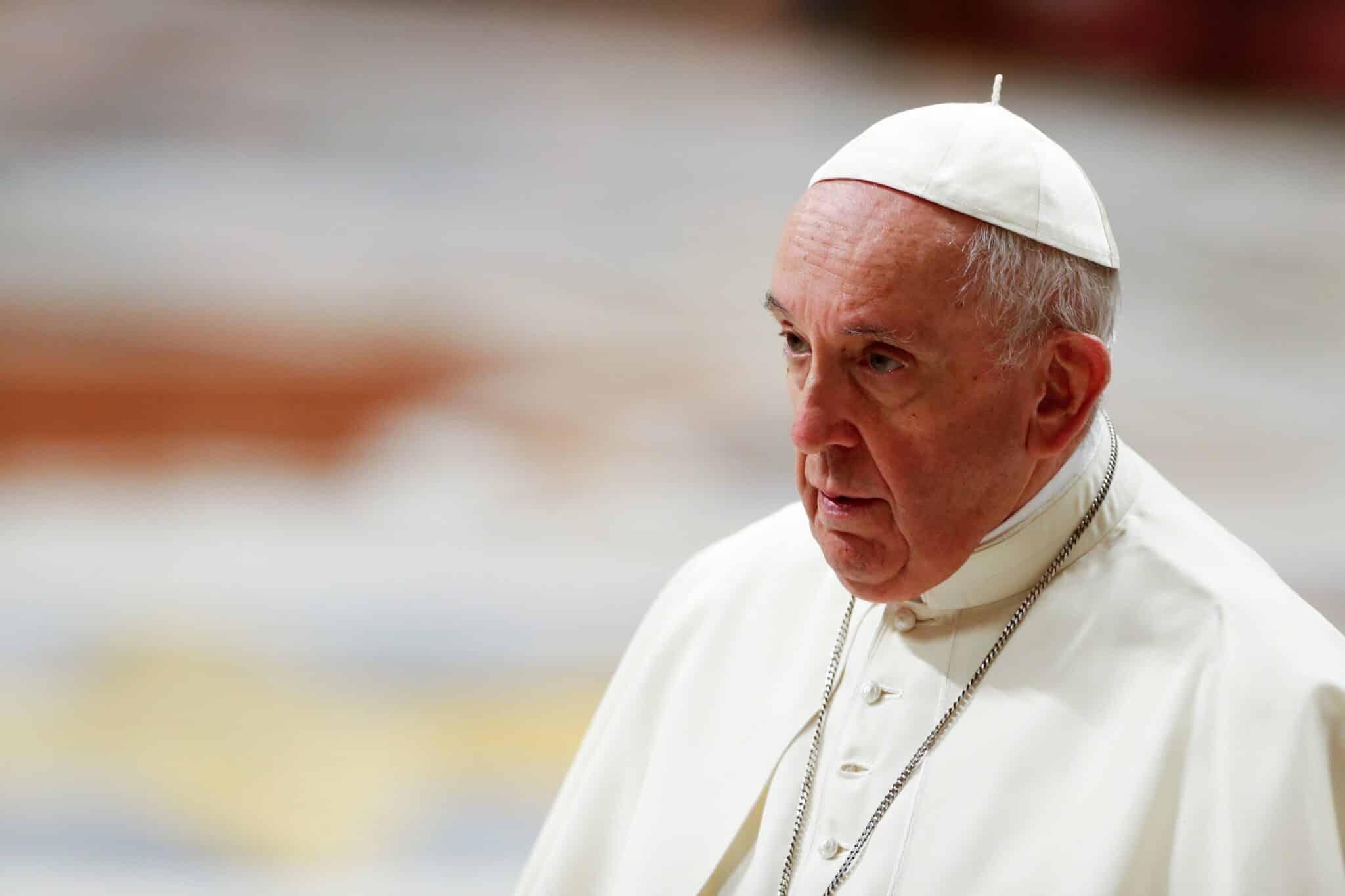 Pope Francis leaves at the conclusion of an evening prayer service in St. Peter's Basilica at the Vatican Dec. 31, 2021. The traditional service on New Year's Eve is to give thanks for the past year. (CNS photo/Remo Casilli, Reuters)