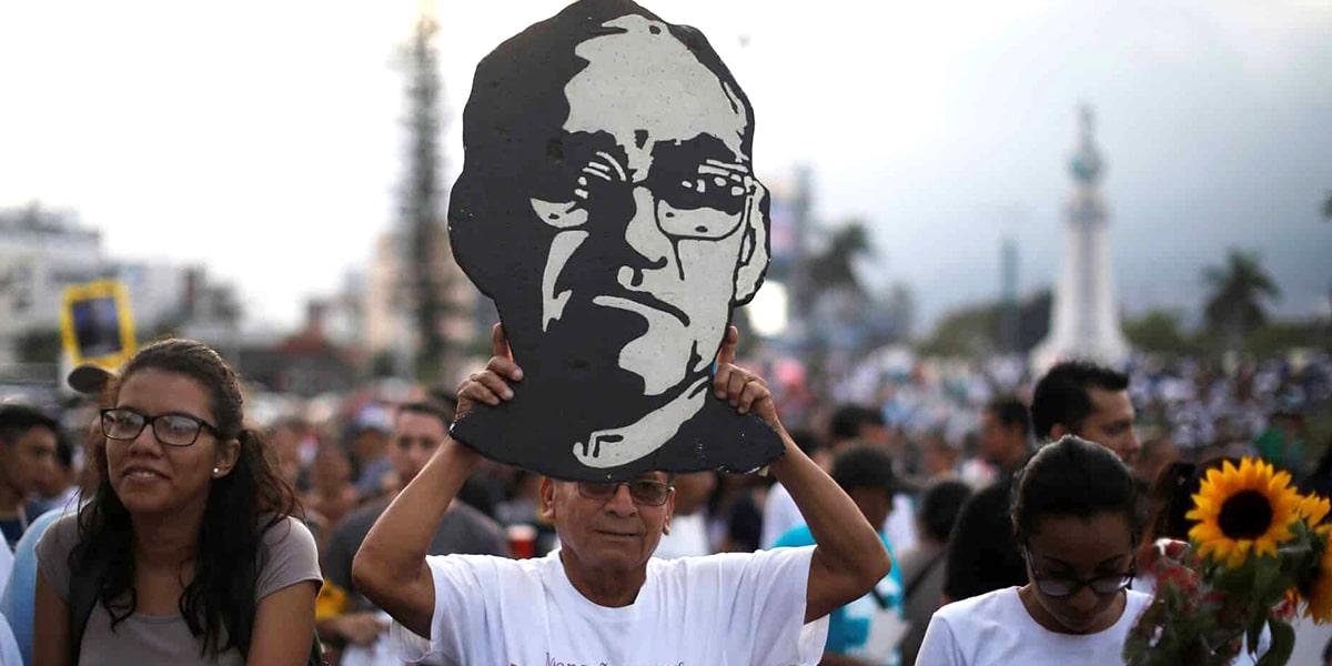 A man carries an image of Blessed Oscar Romero during a March 18 procession in San Salvador, El Salvador, to commemorate the 38th anniversary his murder. Blessed Oscar Romero is a "great guiding light" in the pontificate of Pope Francis, said Julian Filochowski, chair of the Archbishop Romero Trust in London May 1. (CNS photo/Jose Cabezas, Reuters)