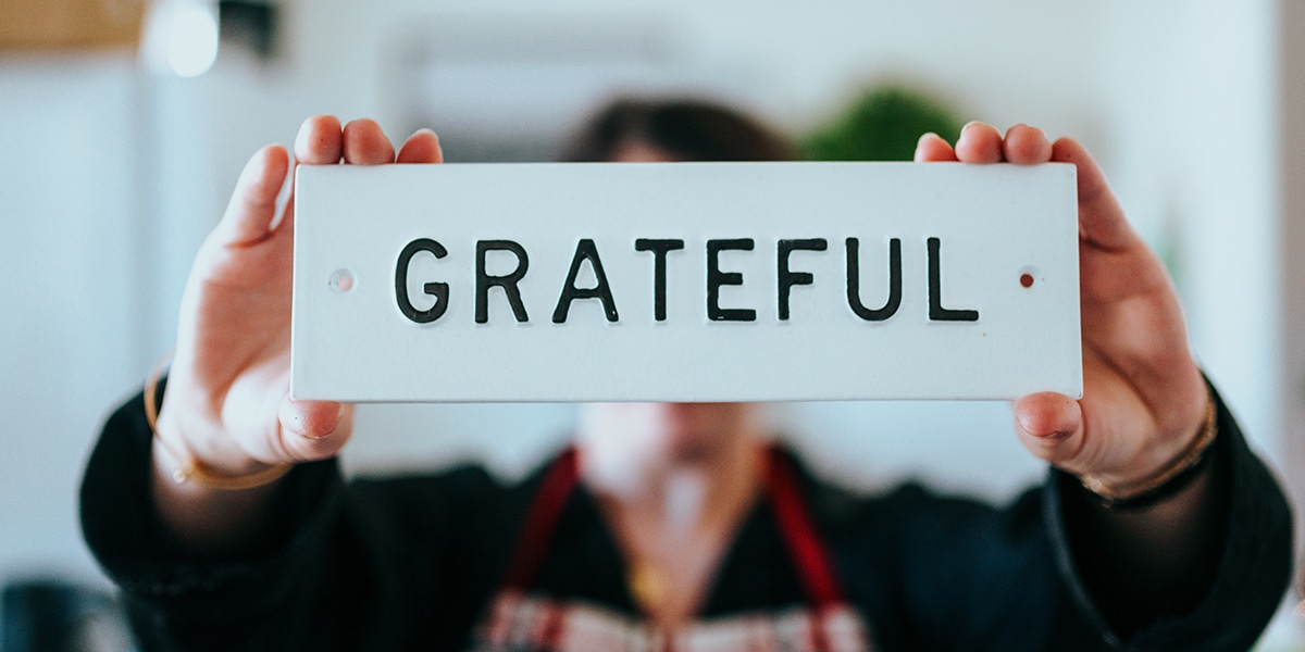 person holding grateful sign