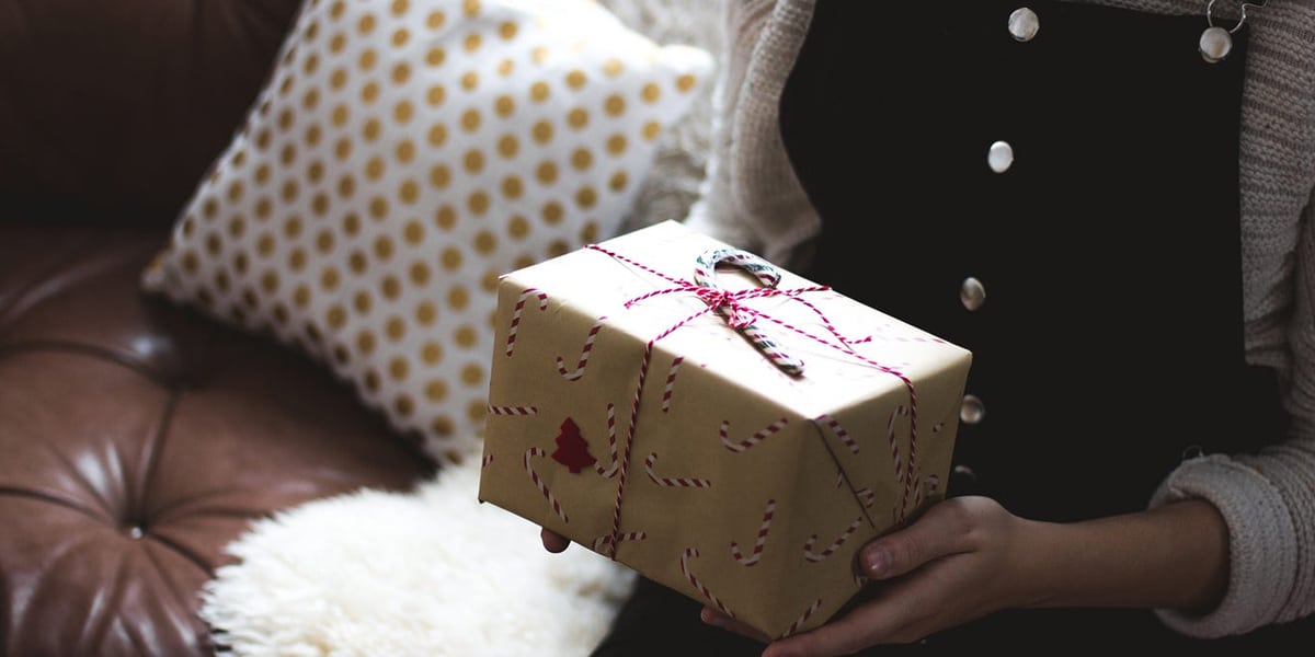 woman holds a gift