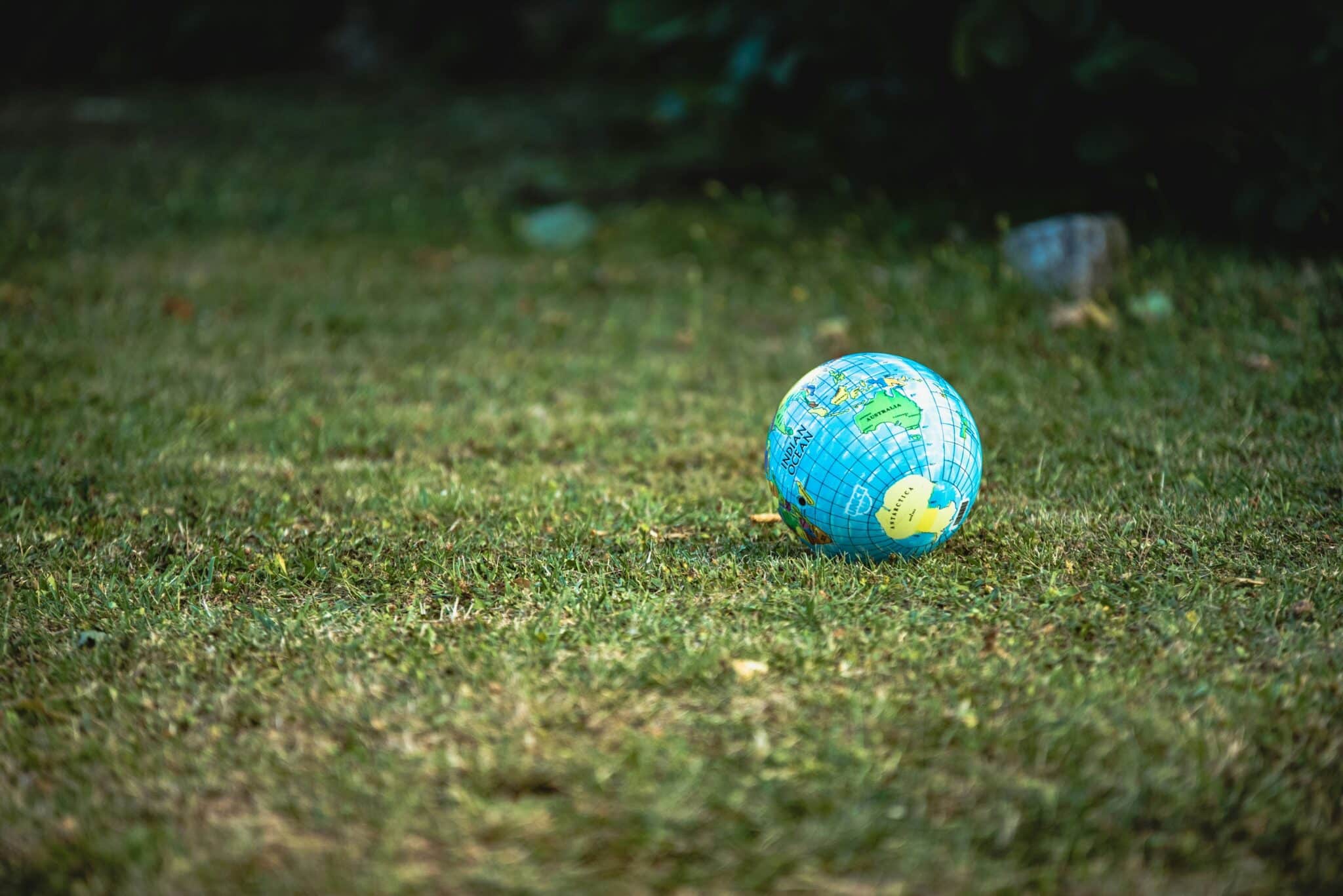 Globes on the ground | Photo by Guillaume de Germain on Unsplash