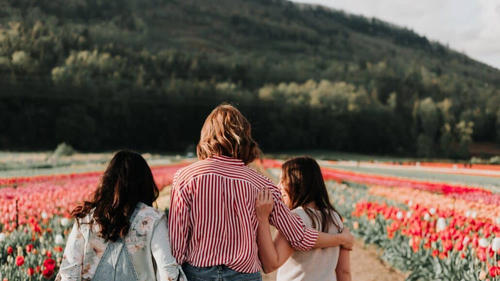 women walking in a field