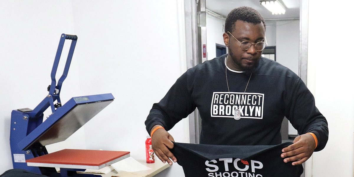 A volunteer works at Reconnect Brooklyn