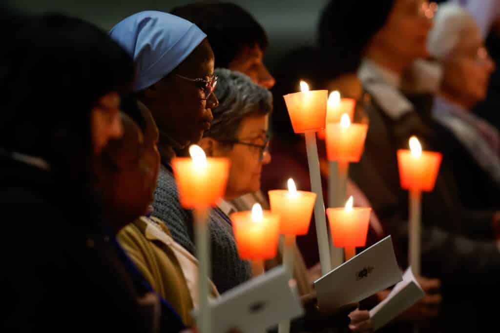 Consecrated women and other members of the congregation hold candles during Pope Francis' Mass on the feast of the Presentation of the Lord and the World Day for Consecrated Life in St. Peter’s Basilica at the Vatican Feb. 2, 2024. (CNS photo/Lola Gomez)