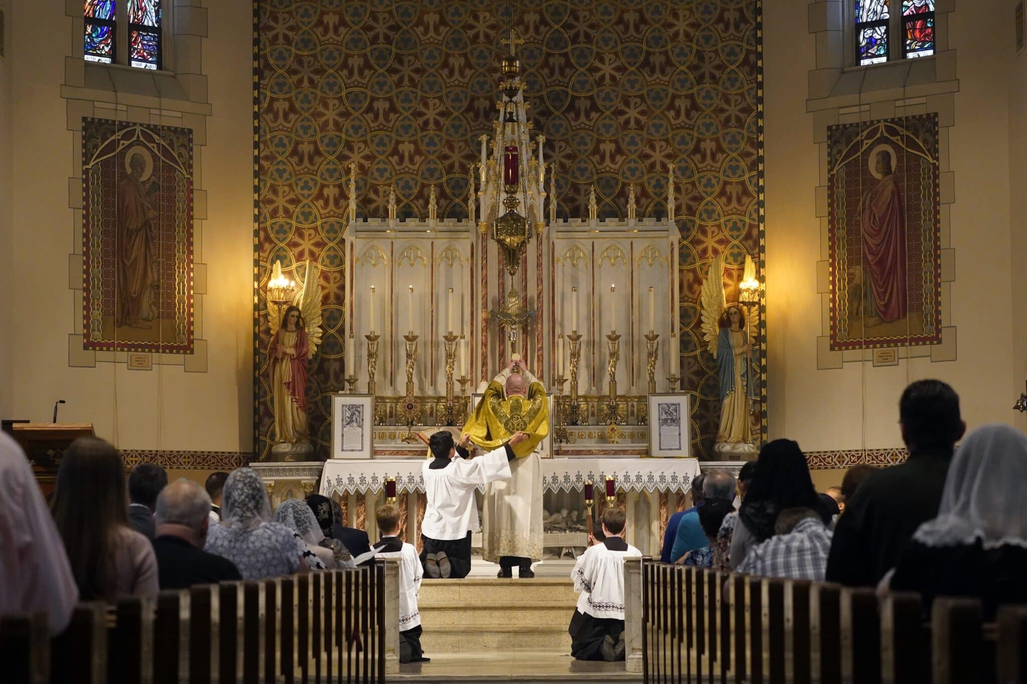 Father Stephen Saffron, parish administrator, elevates the Eucharist during a Tridentine Mass at St. Josaphat Church in the Queens borough of New York City in this July 18, 2021, file photo. The Vatican's Congregation for Divine Worship and the Sacraments has responded to bishops' questions about Pope Francis' July document limiting use of pre-Vatican II Mass. Among the clarifications was that confirmations and ordinations are not permitted to be celebrated according to the older rites. (CNS photo/Gregory A. Shemitz)