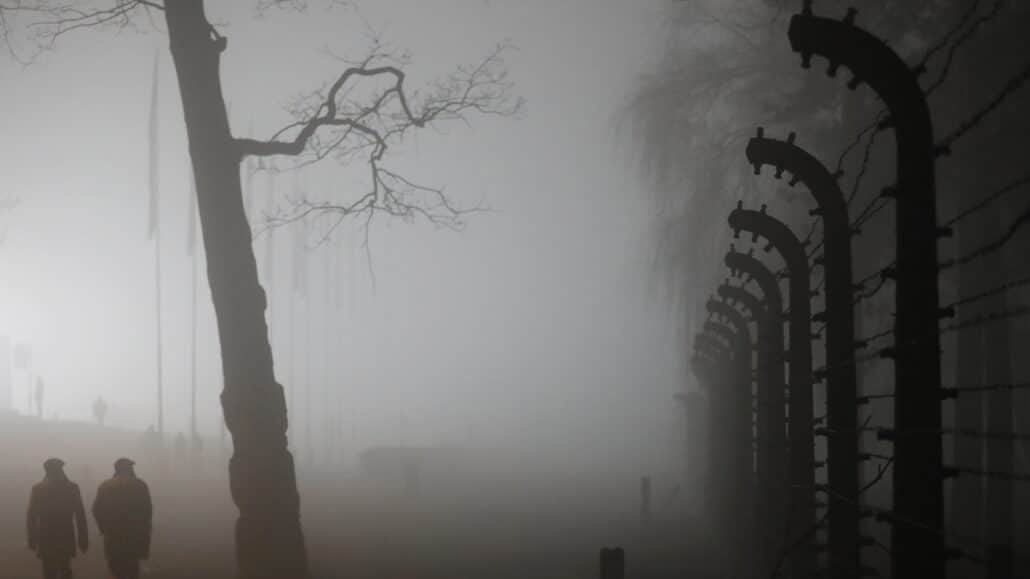 People walk in dense fog in the Auschwitz-Birkenau Nazi death camp during ceremonies in late January marking the 73rd anniversary of the liberation of the camp and International Holocaust Victims Remembrance Day in in Oswiecim, Poland. (CNS photo/Kacper Pempel, Reuters)