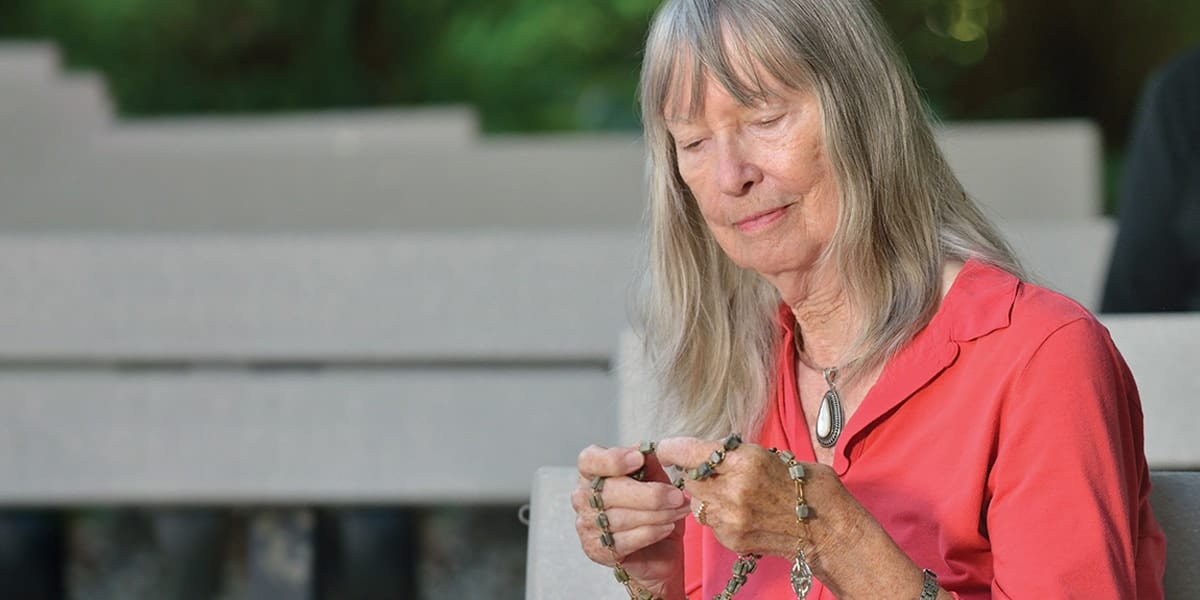 Author Gloria Hutchinson prays the rosary