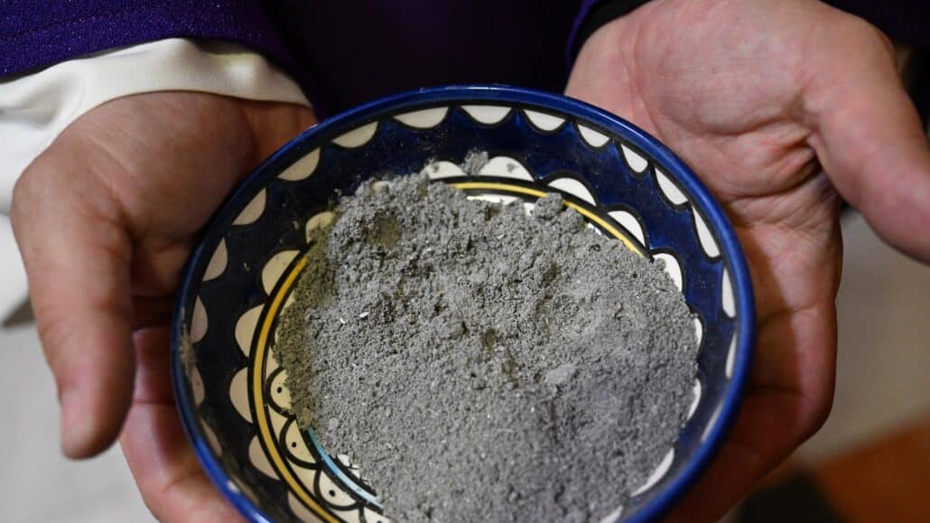 A priest holds ashes to distribute during Ash Wednesday Mass at St. Catherine's Church in Bethlehem, West Bank, Feb. 14, 2024. (OSV News photo/Debbie Hill)