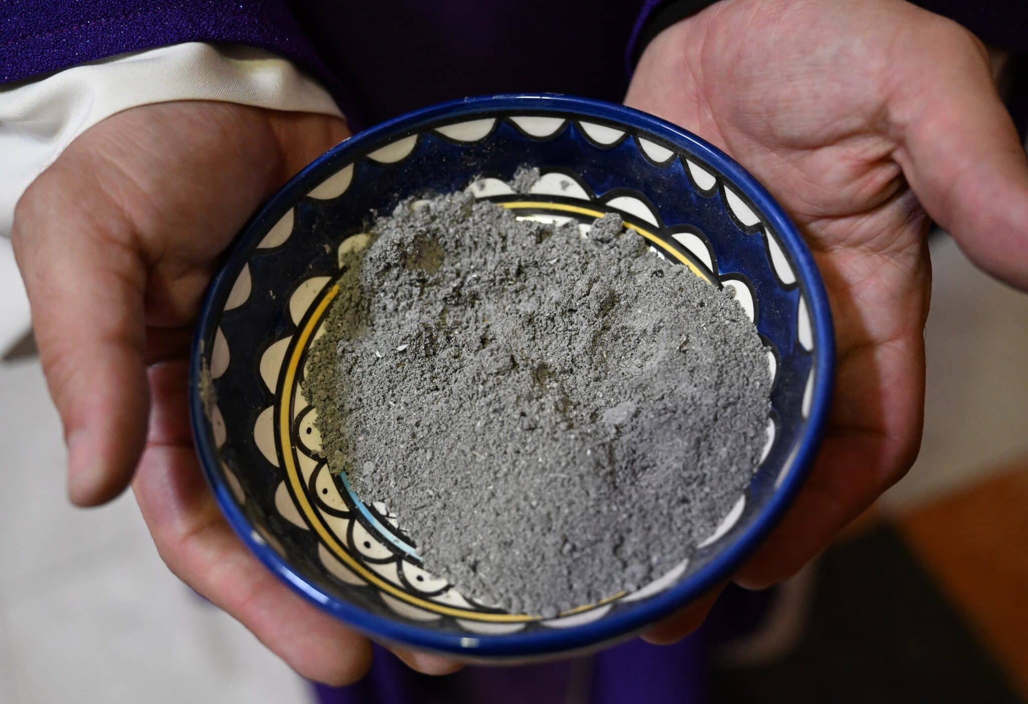 A priest holds ashes to distribute during Ash Wednesday Mass at St. Catherine's Church in Bethlehem, West Bank, Feb. 14, 2024. (OSV News photo/Debbie Hill)