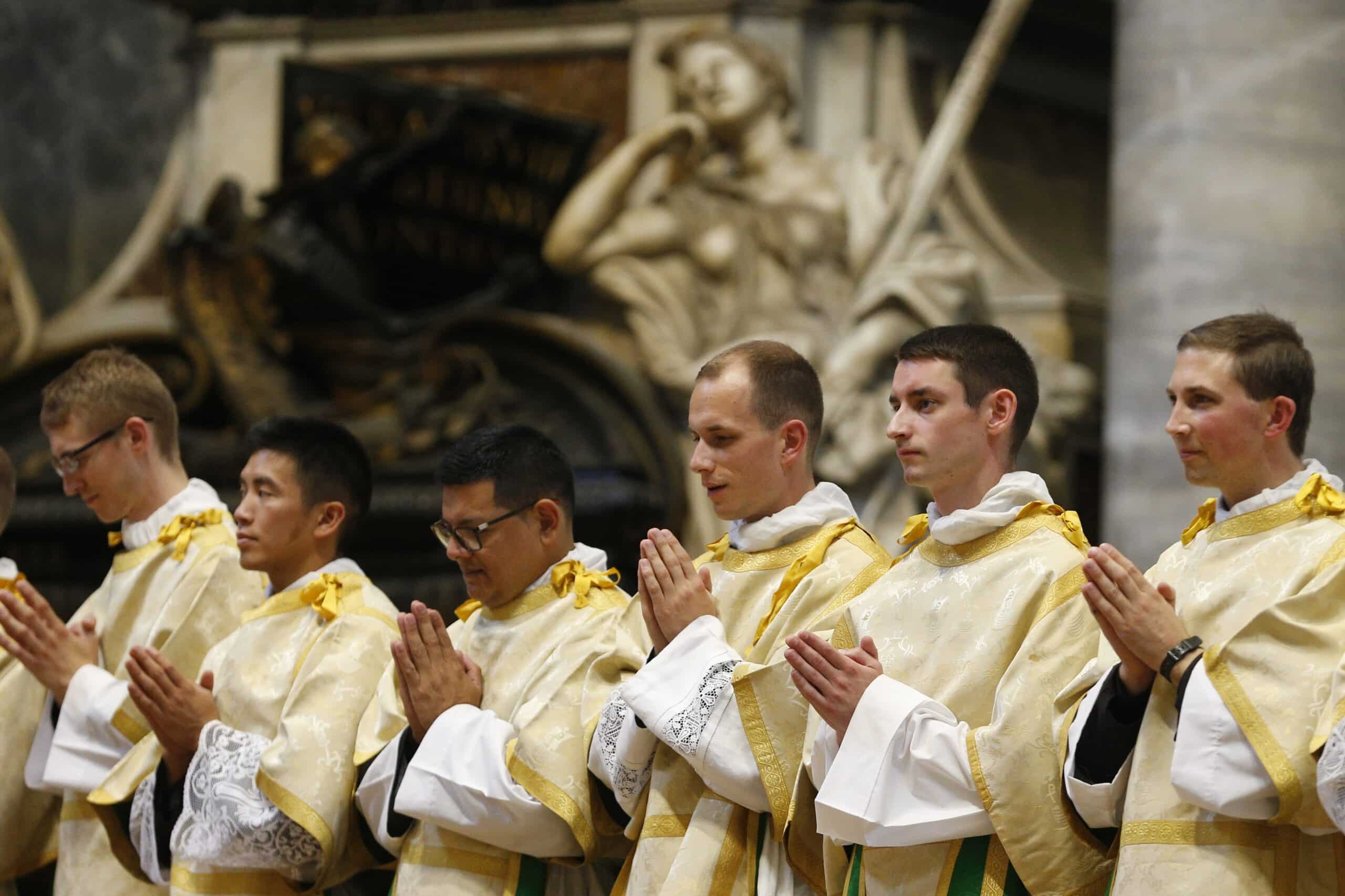 New deacons from the Pontifical North American College are pictured during their ordination in St. Peter's Basilica at the Vatican Sept. 29, 2022. Twenty-two seminarians from 17 U.S. dioceses and one from the Archdiocese of Sydney were ordained to the transitional diaconate. (CNS photo/Paul Haring)