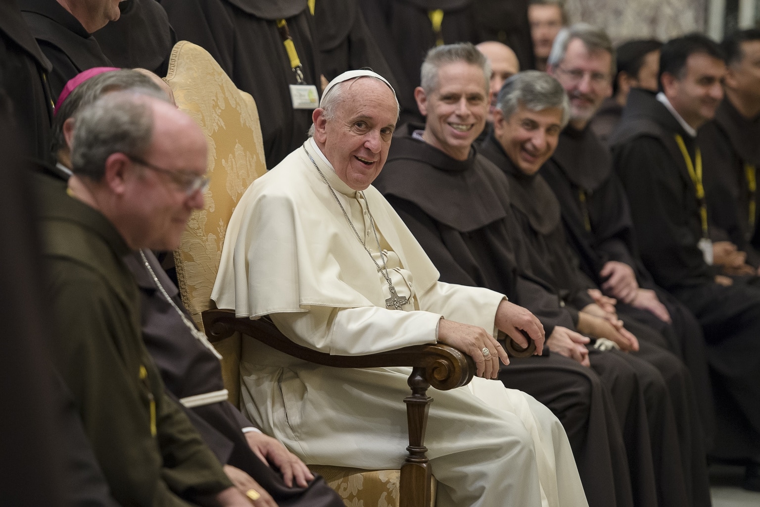 Pope Francis meets with delegates to the general chapter of the Order of Friars Minor during an audience with 200 Franciscan leaders at the Vatican May 26. U.S. Franciscan Father Michael Perry, who was re-elected head of the order May 21, is seated to the right of the pope. (CNS photo/L'Osservatore Romano) See POPE-FRANCISCANS May 26, 2015.