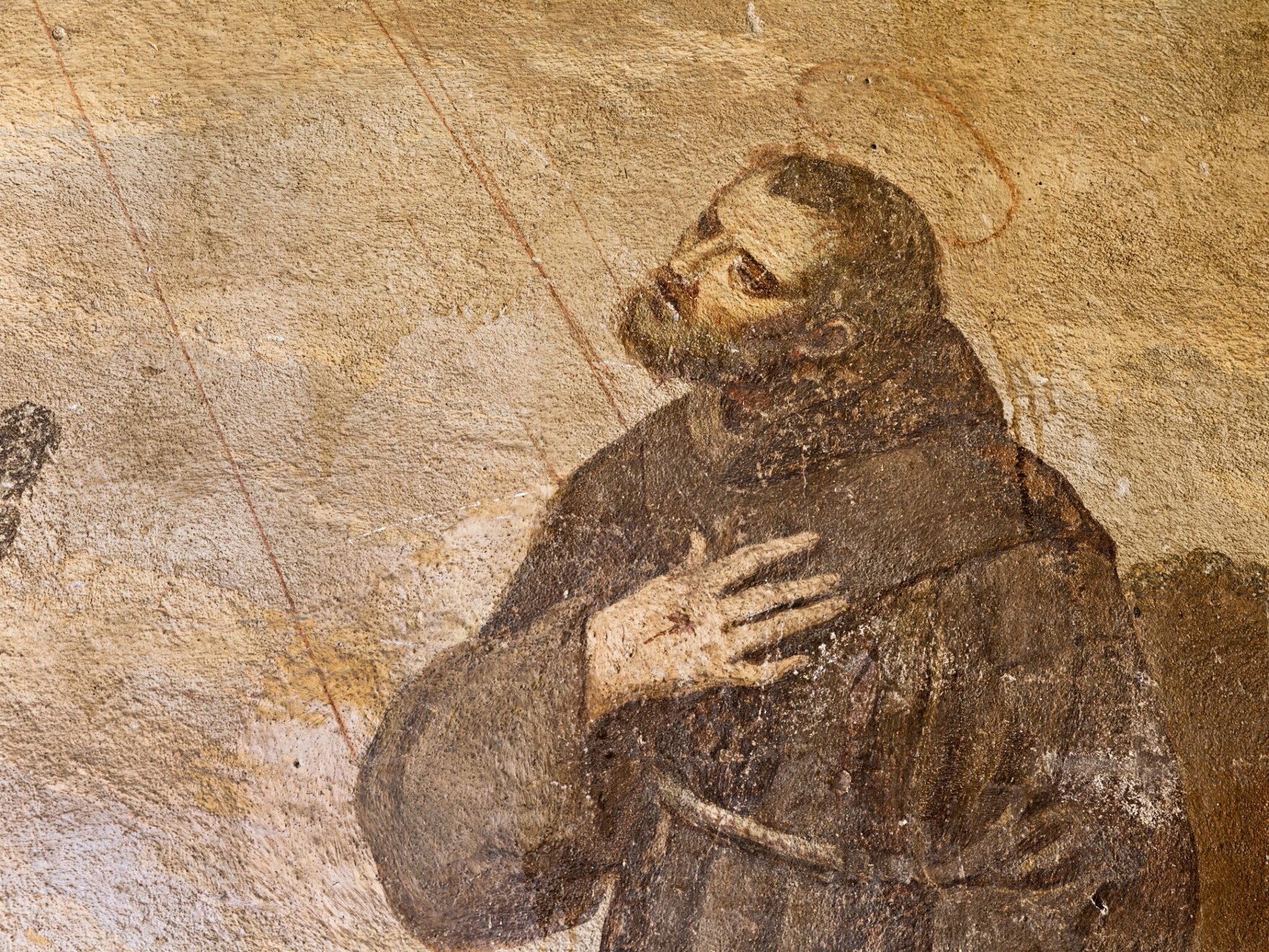 Fresco of St. Francis in prayer