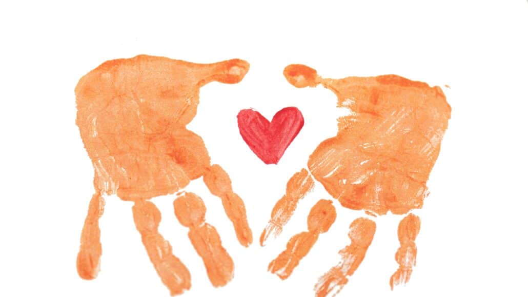hand print with a heart | Photo by Rod Long on Unsplash