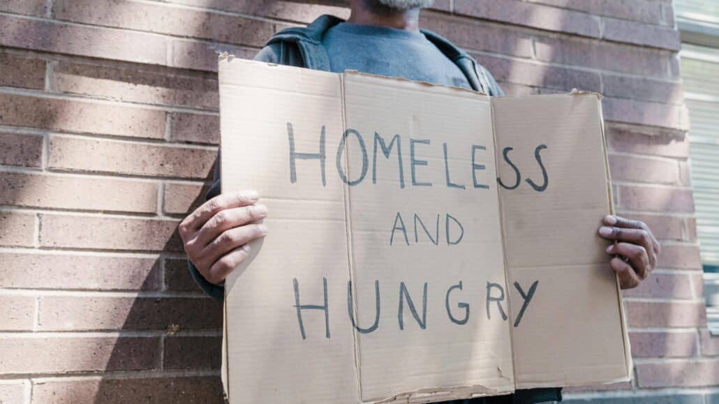 Homeless sign | Photo by Timur Weber