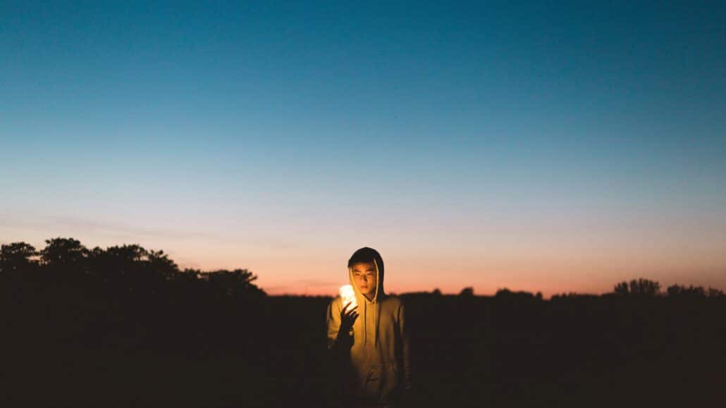 man with a jar of light | Photo by Kyle Wong on Unsplash