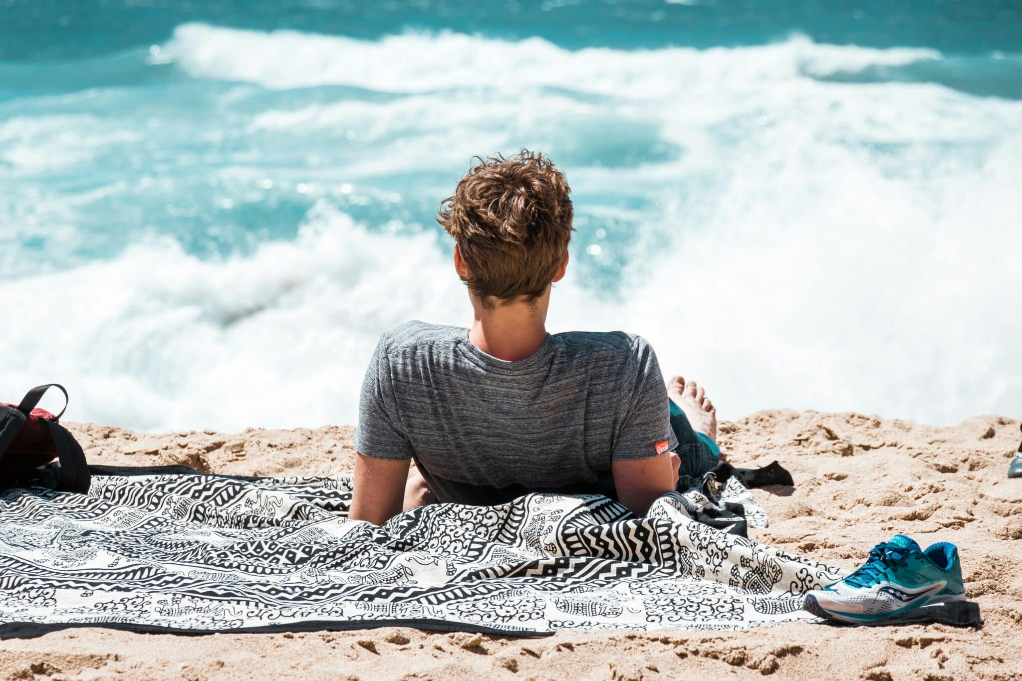 man on a beach | Photo by Patrick Robert Doyle on Unsplash