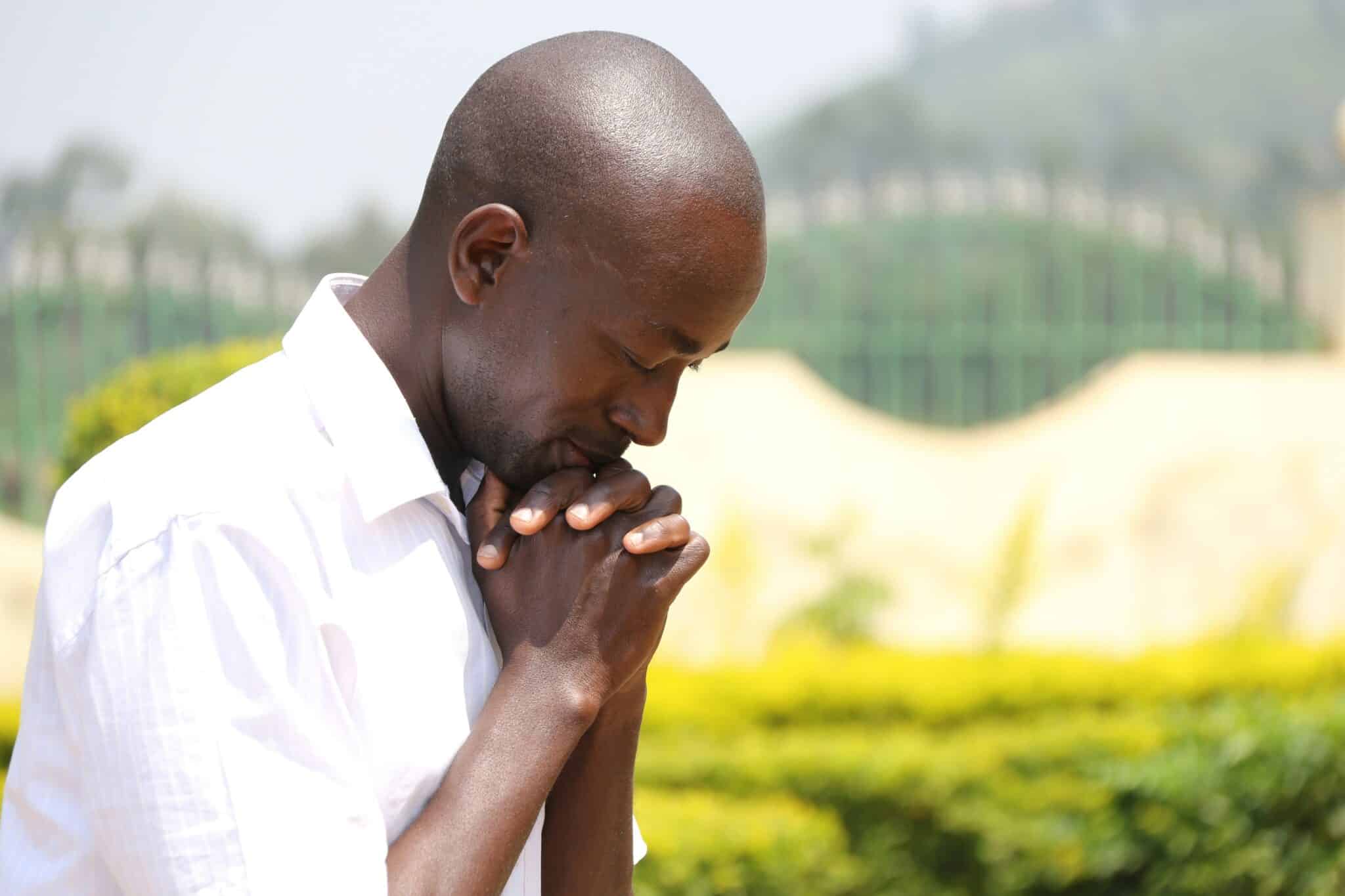 Man praying outside | Photo by West Kenya Union Conference Adventist Media on Unsplash