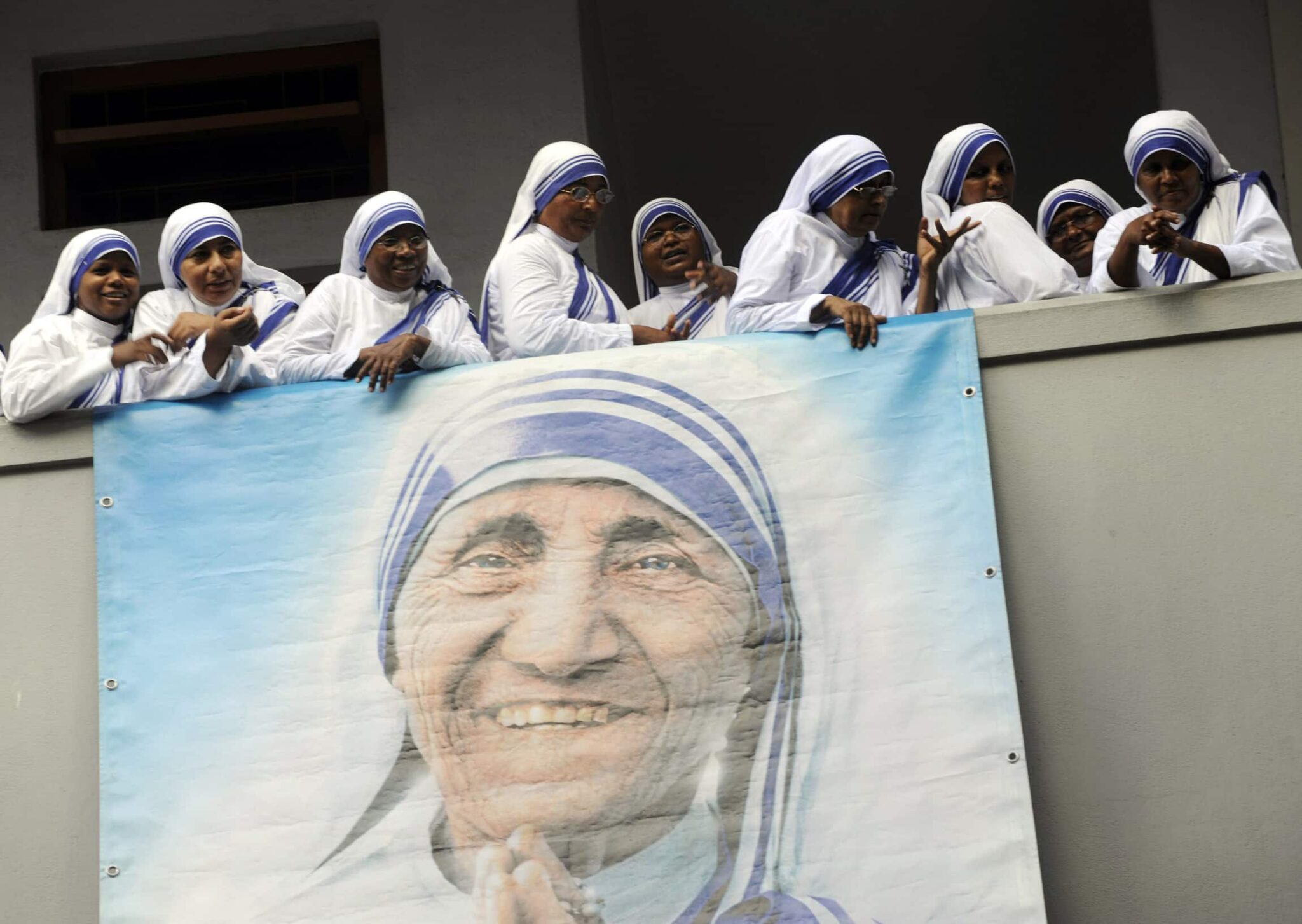 Members of the Missionaries of Charity attend a service marking the 100th anniversary of the birth of Blessed Teresa of Kolkata in this Aug. 26, 2010, file photo. Pope Francis has approved a miracle attributed to the intercession of Blessed Teresa, paving the way for her canonization in 2016. (CNS photo/Deshakalayan Chowdhur, Reuters pool)