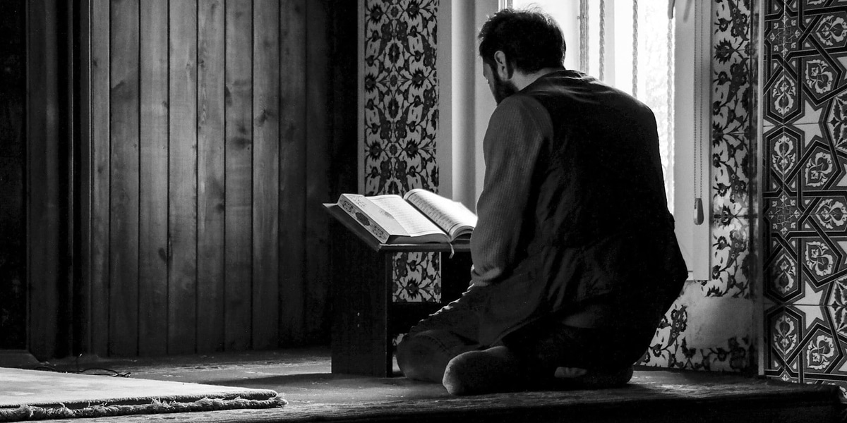 Man praying the Quran