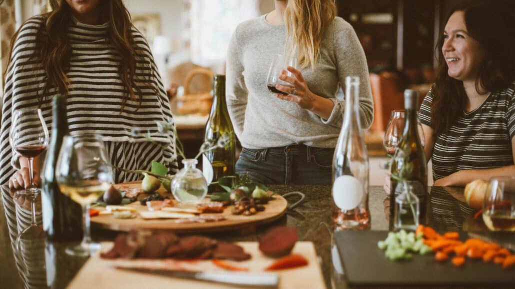 Women in the kitchen laughing | Photo by Kelsey Chance on Unsplash