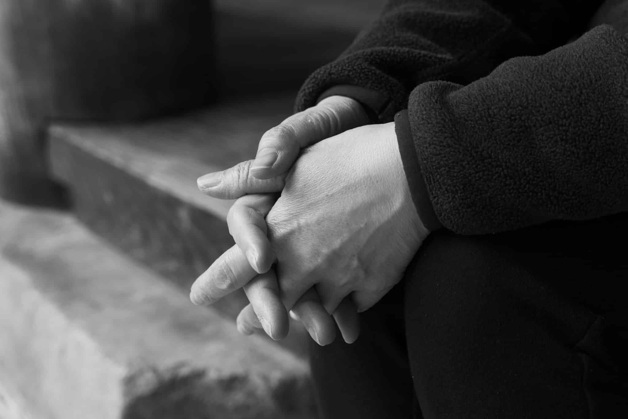 Woman with hands folded | Photo by Jaee Kim on Unsplash