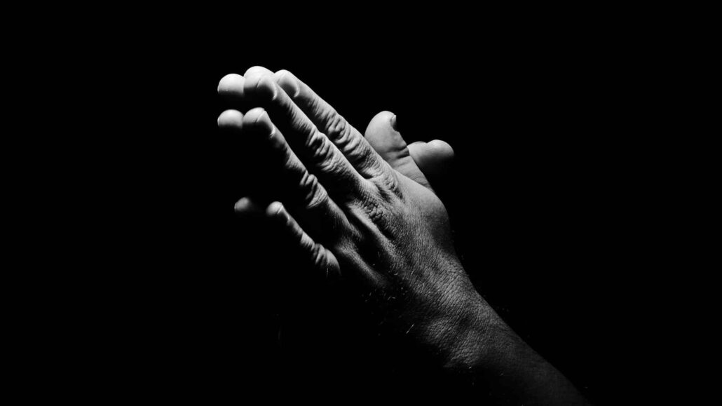 Hands together in prayer