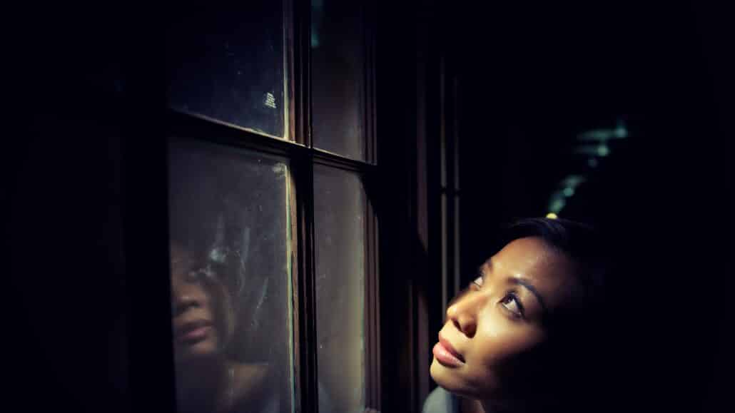 Woman looking out a window