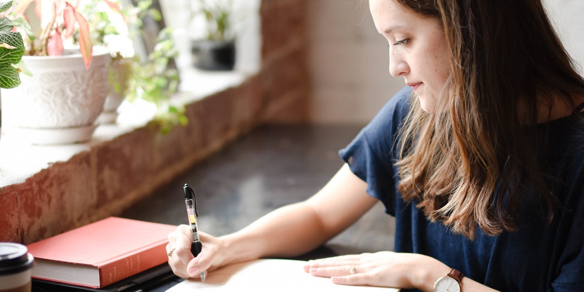 Woman writing in her journal