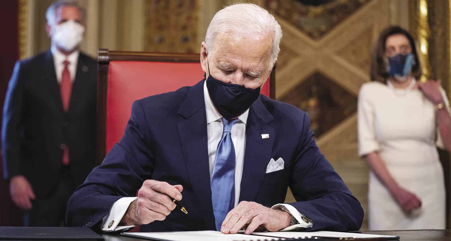 President Biden signing document