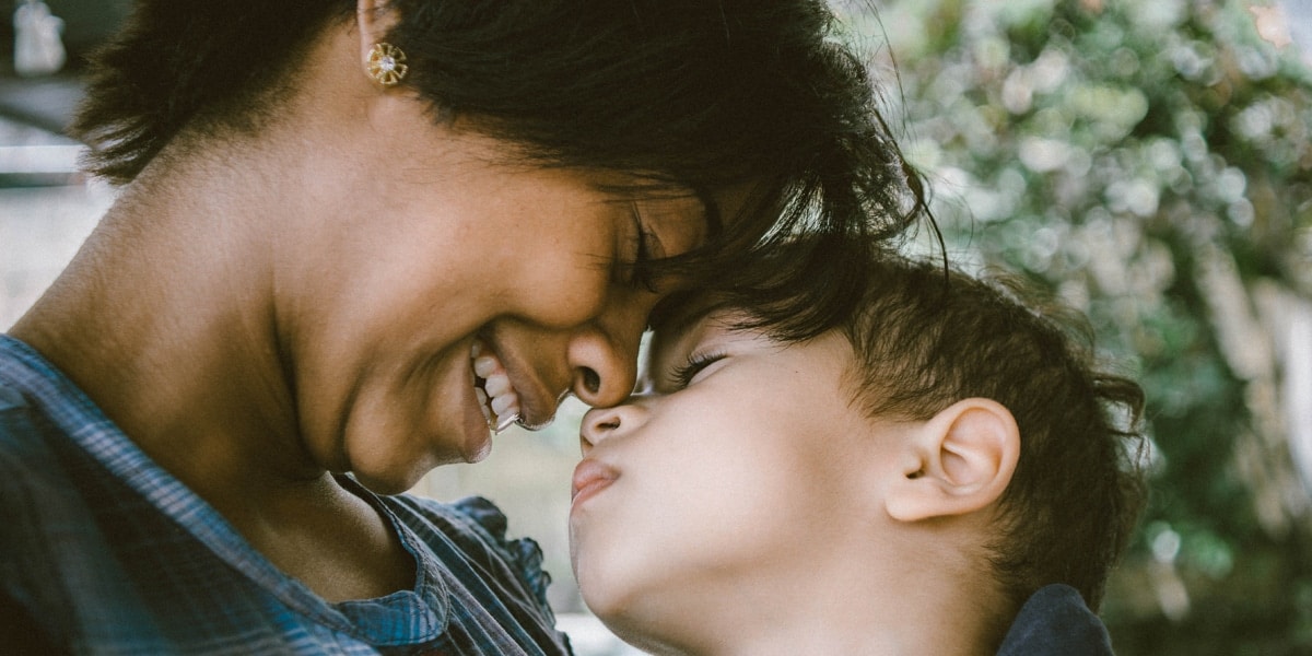 Mother and son show affection