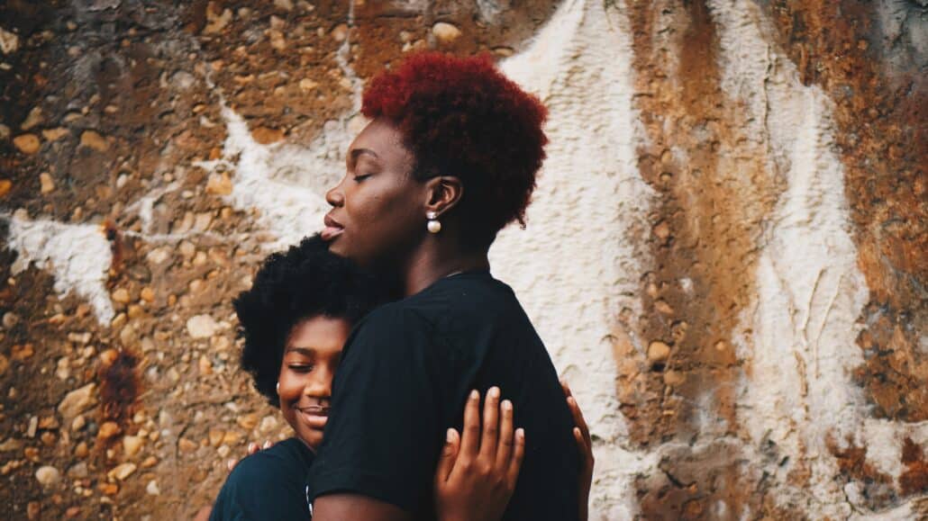 Mom hugs daughter