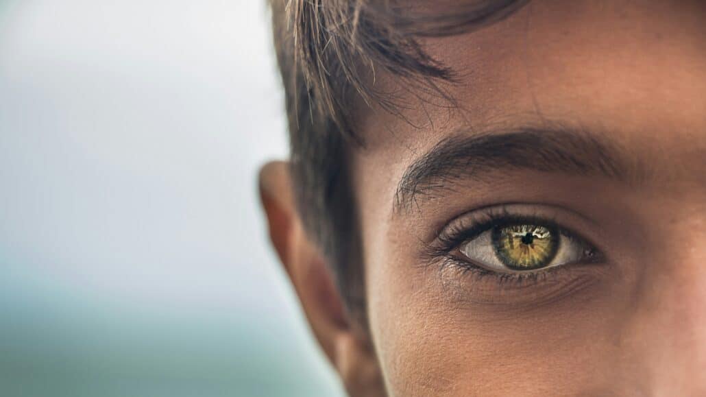 Young man with brown eyes | Photo by MohammadHosein Mohebbi on Unsplash