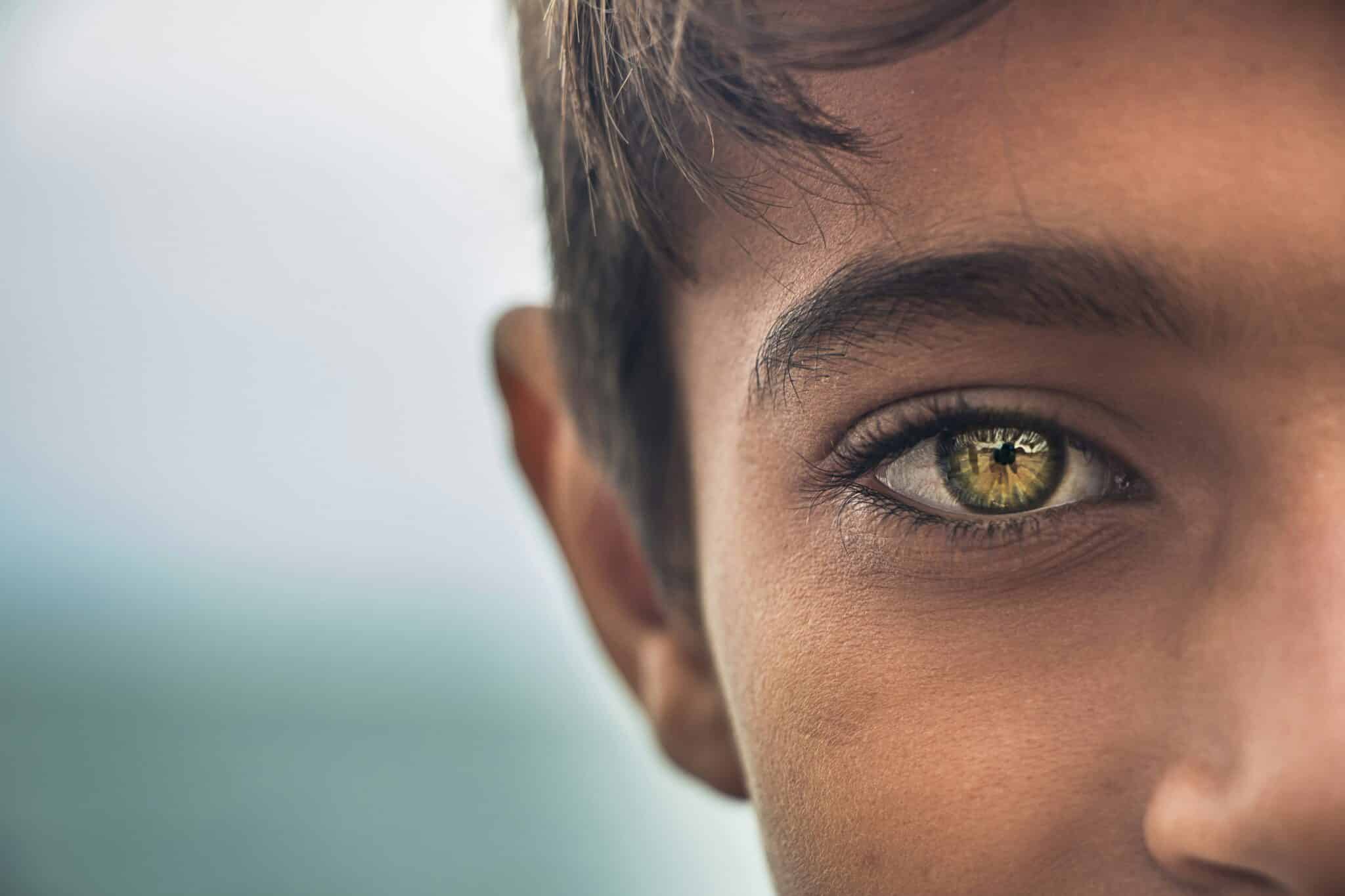 Young man with brown eyes | Photo by MohammadHosein Mohebbi on Unsplash