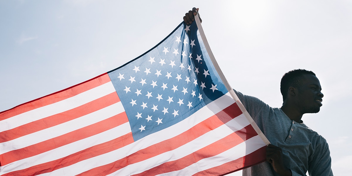 Man holds an American flag