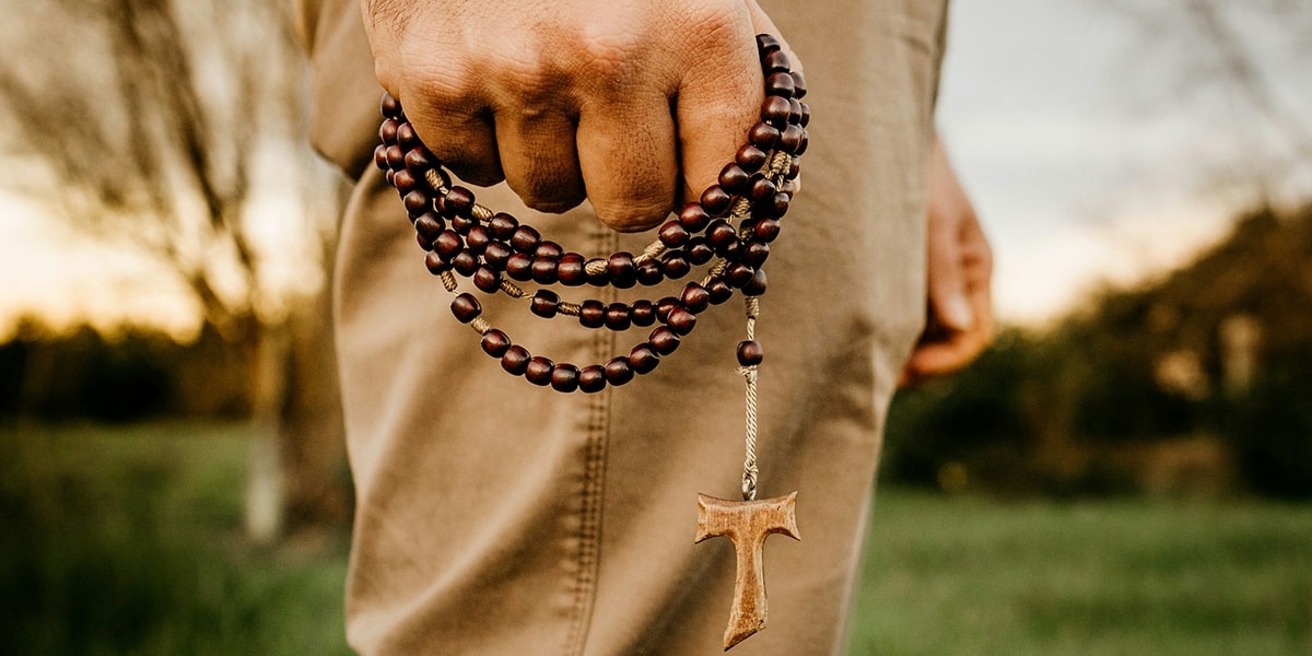 man holding a rosary