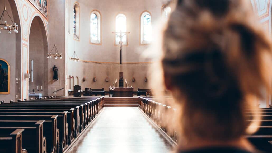 Woman at the back of church