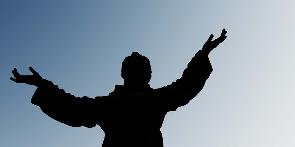 statue of saint francis with arms outstretched