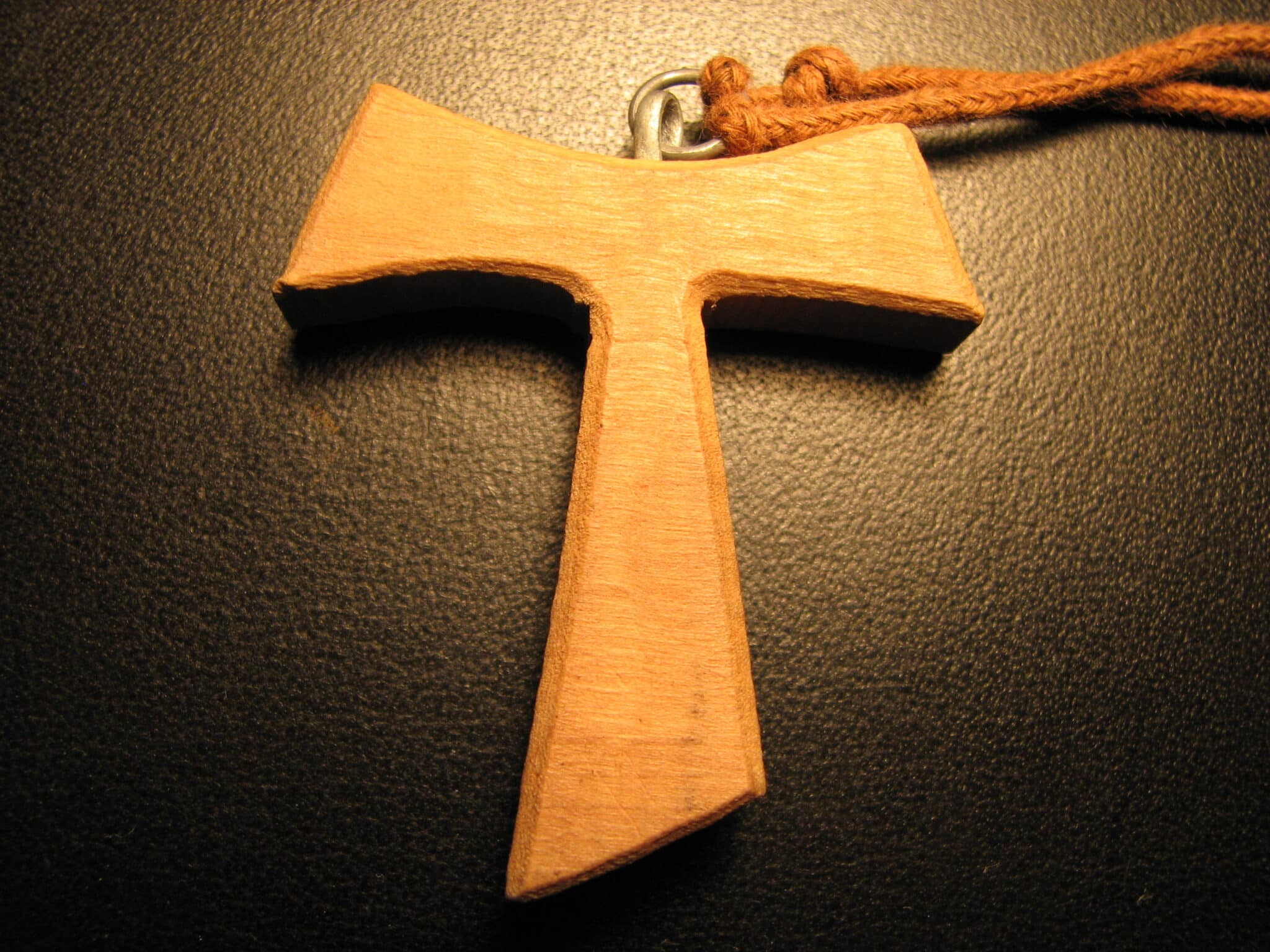 Designed wooden cross on a necklace