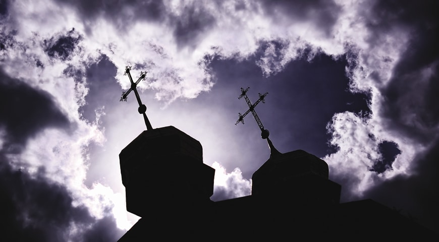 Church steeples with the sky in the background