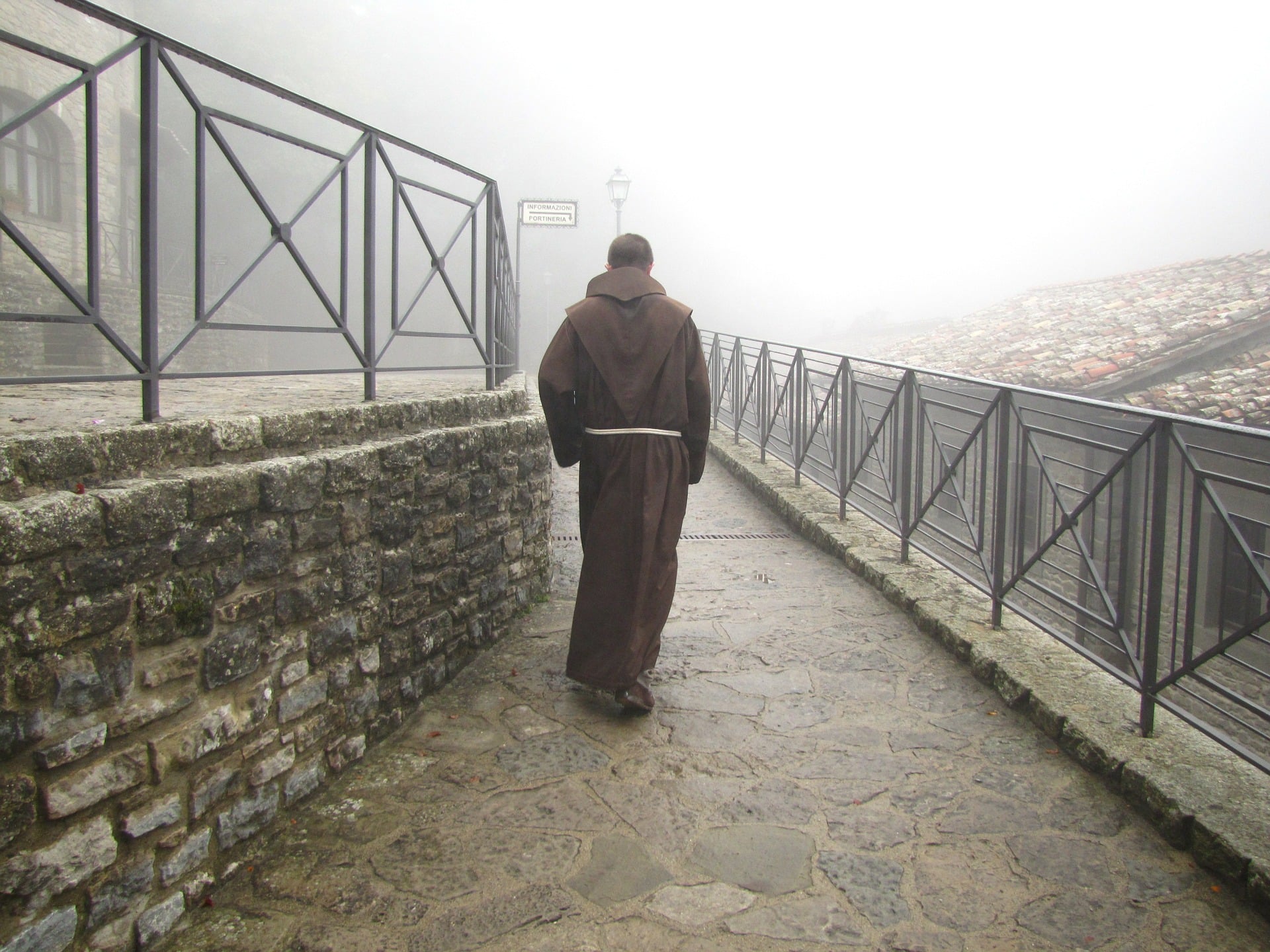 Franciscan friar walking outside of an Italian church