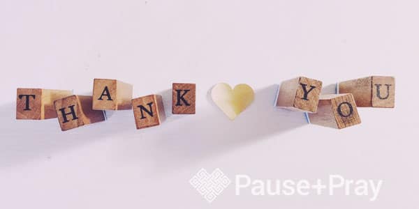 Thank you spelled out on wooden cubes