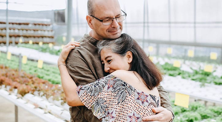 Older couple hugging