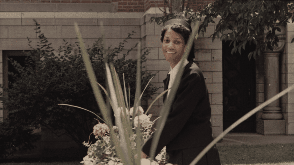 Thea Bowman smiling near flowers